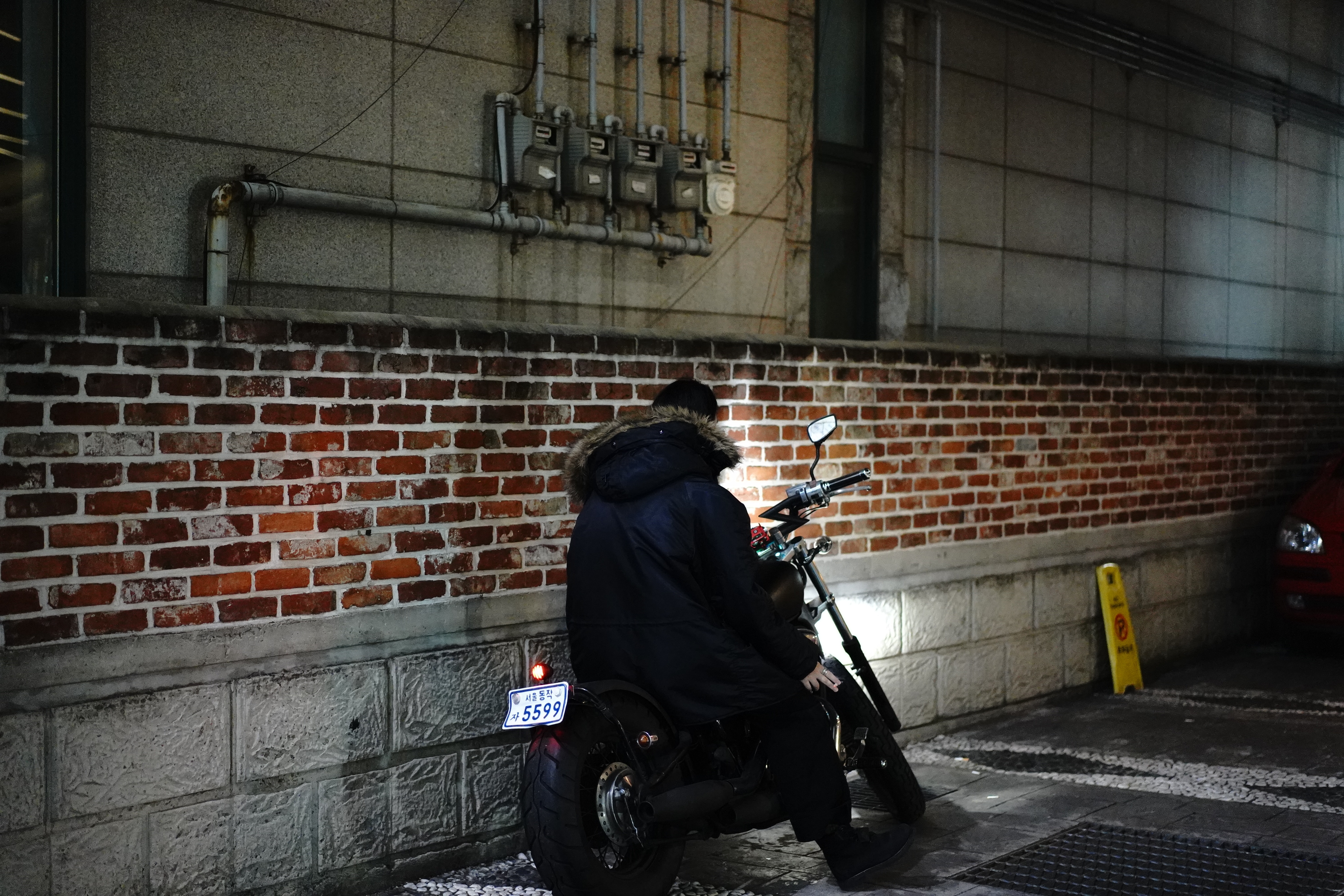 man in black jacket riding black motorcycle